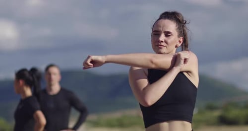 Woman Stretching Her Arms Before a Workout