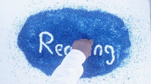 Writing the Word Reading in Pencil Shavings