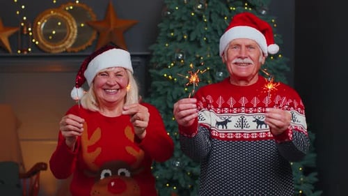 Senior Couple Celebrating Christmas with Sparklers
