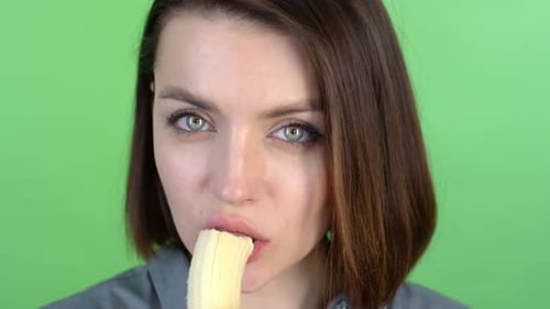 Close Up of Woman Eating a Banana