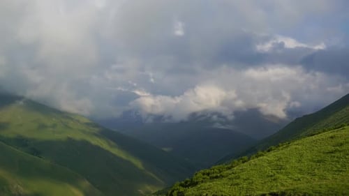 Rolling Green Mountains meet Overcast Sky