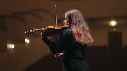 Female Violinist is Playing Fiddle in Music Hall Medium Portrait of Musician in Philharmonic Hall