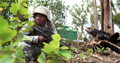 Soldier Crouching with Assault Rifle in Forest