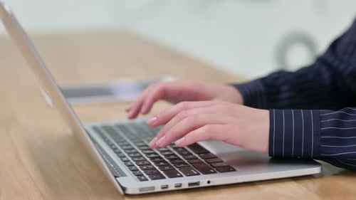 Close Up of Woman Typing on Laptop