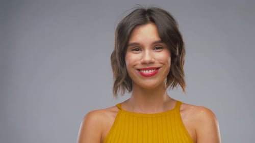 Happy Laughing Young Woman in Yellow Top