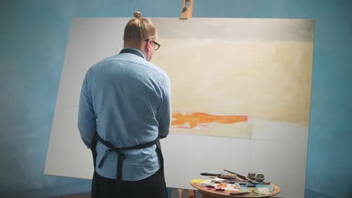 Artist Creating Abstract Painting in Art Studio