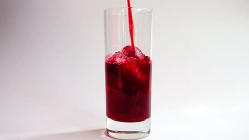 Icy Cherry Juice Filling a Clear Glass