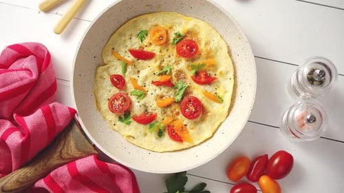 Savory Omelet with Tomatoes and Herbs in Pan
