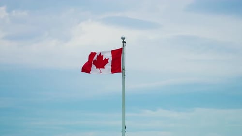 Canadian Flag Waving Proudly in the Wind