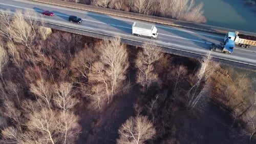 Trucks And Cars On The Bridge