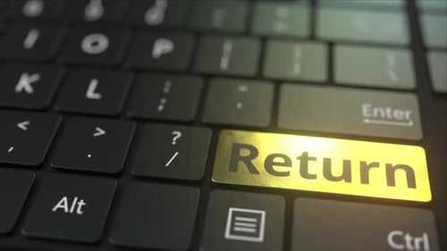 Black Computer Keyboard and Gold Return Key