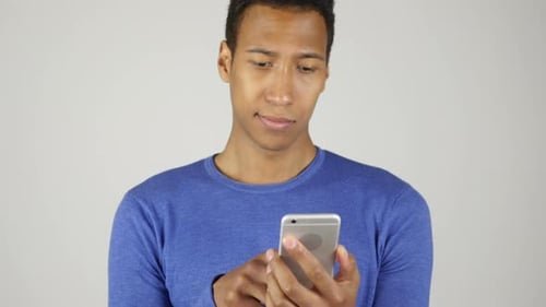 Man Using Smartphone in Close Up Studio Shot