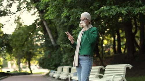 Beautiful Young Woman with Hijab Working Using Smartphone During Coffee Break