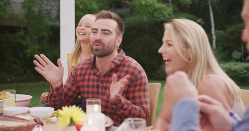 Family Celebrates Together at Outdoor Garden Meal