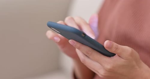 Hands Using Smart Phone in Close Up Shot