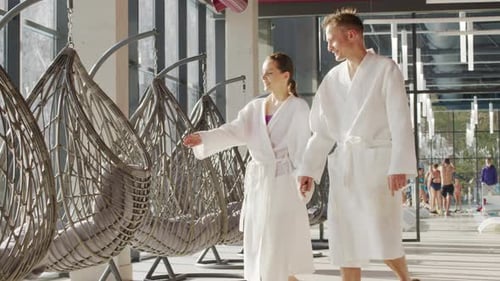 Couple In Lounge Zone At Pool