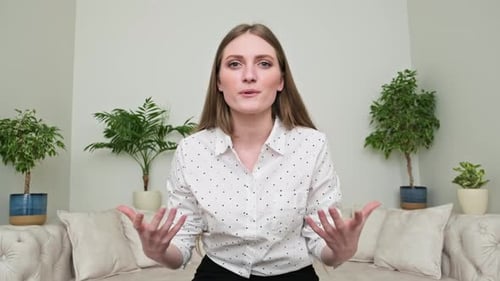 Young Adult Woman Explaining While Sitting on Couch