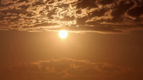 Golden Sunrise with Slow Moving Clouds