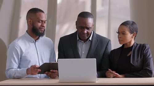 Serious Upset Adult African Mature Business Man Boss Talks About Mistakes in Startup Project to