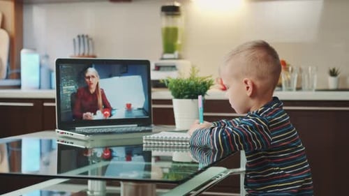 Child Learning Online at Home in Kitchen