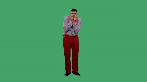 A Portrait of a Man Looking Straight Ahead and Pressing His Hands Into a Fist to His Chin in Fear