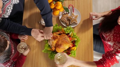 Family Gathering Around Festive Holiday Dinner Table