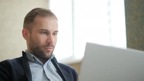 Man Working on Laptop