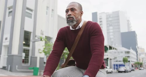 African American man biking in the street