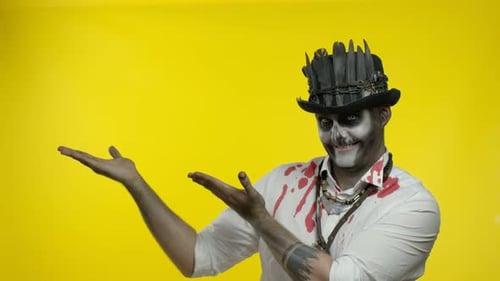 Man with Halloween Makeup Gestures to Camera