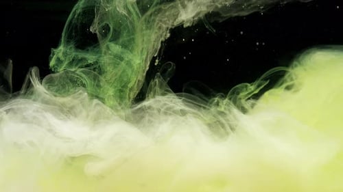 Green and Yellow Ink Acrylic Paint Mixing in Water Swirling Softly Underwater