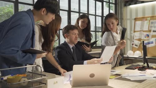 Diverse Team Working Together in Modern Office