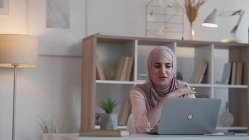 Woman Video Calling on Laptop in Bright Room