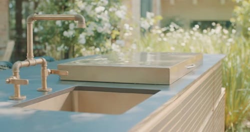 Tracking shot of an outdoor luxury kitchen in a backyard