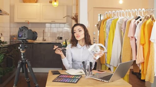 Blogger Shoots a Video on a Professional Camera for Her YouTube Channel. Remote Work During the