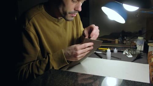Person Tailor Who Works with Leather in Workplace