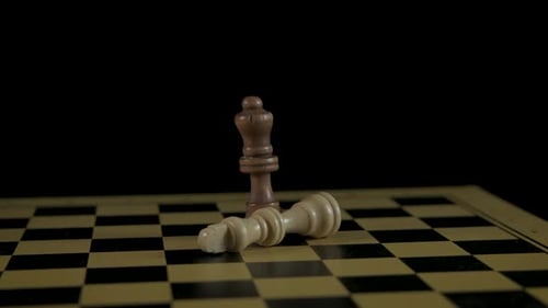 Chess Queen Standing While Other is Fallen