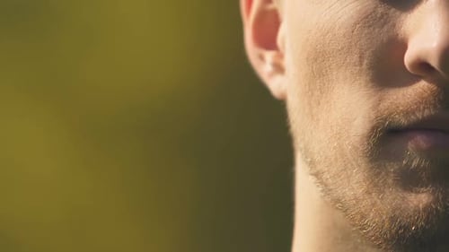 Half Face Portrait of Unhappy Man Trying to Control Negative Emotions, Closeup
