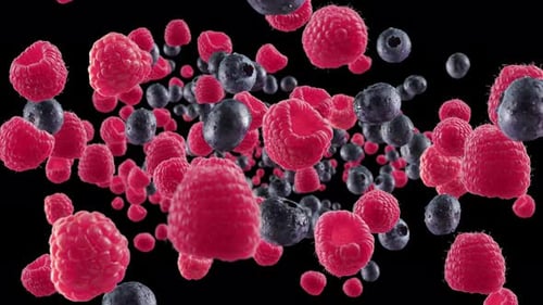 Falling Raspberries and Blueberries with Water Drops on Black