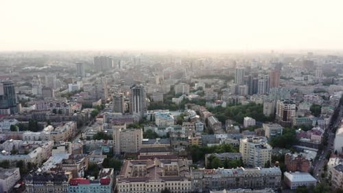 Aerial view of a beautiful and cozy evening city with narrow streets