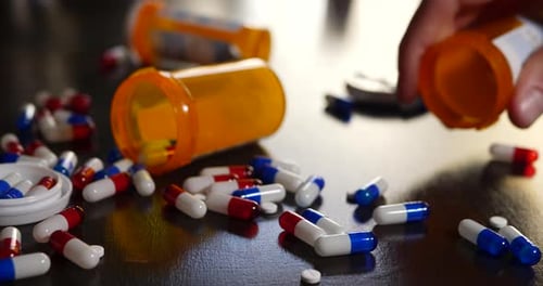 Close Up of Pills and Hand Sorting