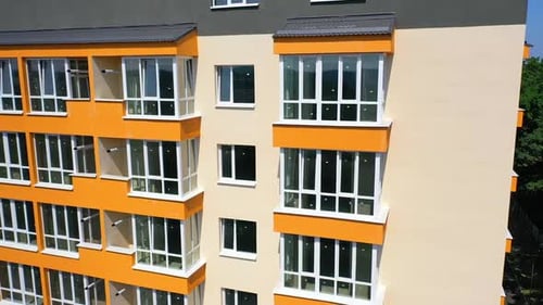 Aerial view of newly built modern high rise apartment building facade