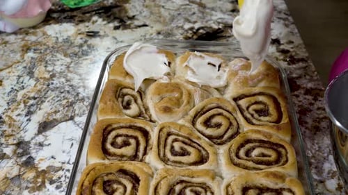 Icing Freshly Baked Cinnamon Rolls at Home