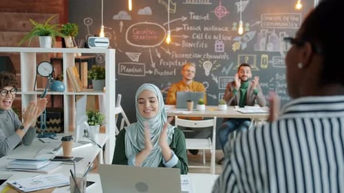 Excited Office Workers Listening to Boss Applauding and Doing Highfive Enjoying Good News