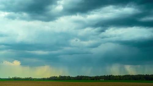 Stormy Sky over Open Field with Rain