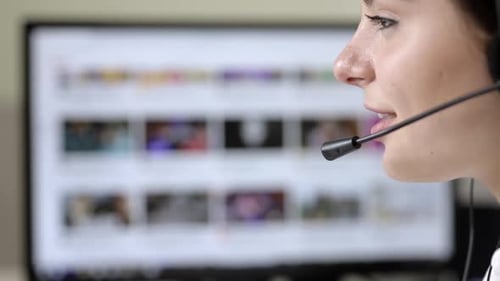 Call center employee talking to a client using a headset