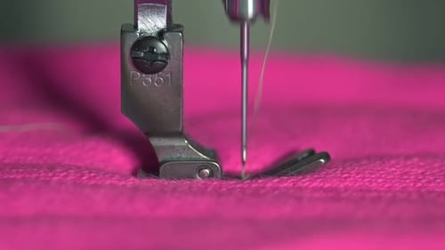 Sewing Machine Stitching Vivid Pink Fabric Close-Up