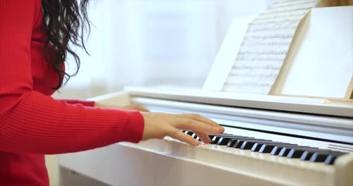 Woman Playing Piano Indoors