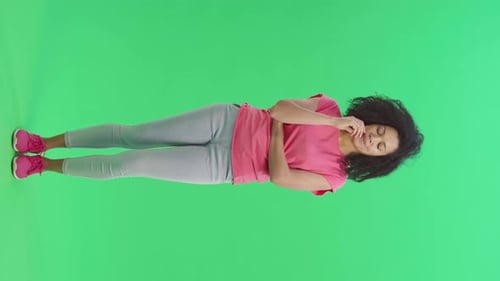 Woman Presenting Ideas on Green Screen Backdrop