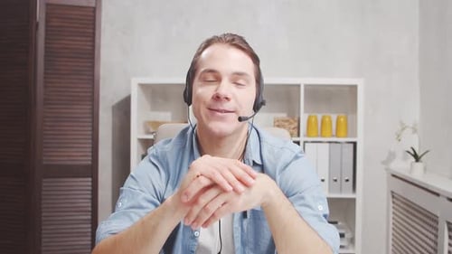 Workplace of freelance worker at home office. Young man works using computer.