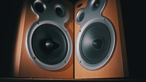 Audio Speakers Vibrate From Sound Bass in Slow Motion on Black Background